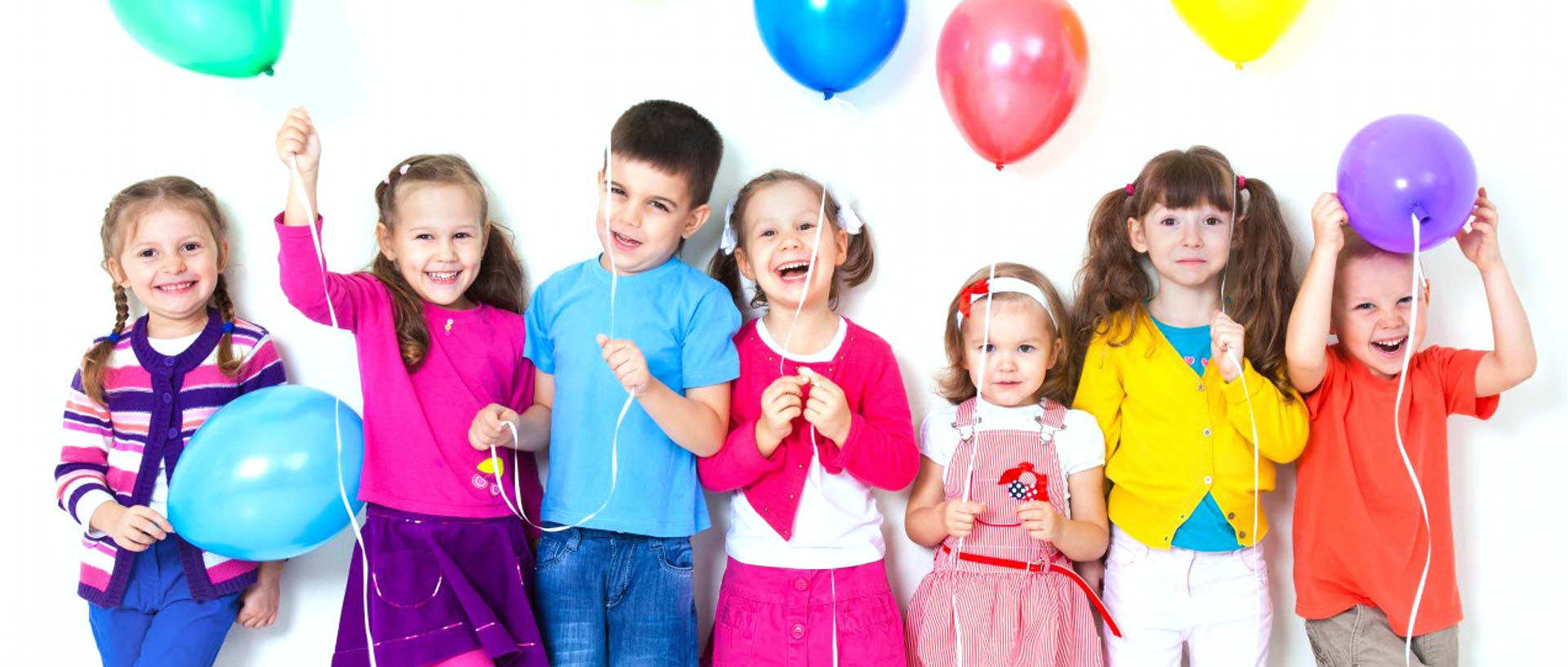 kids holding balloons