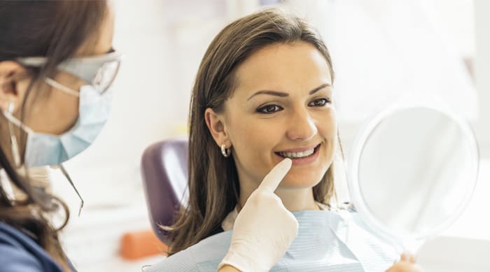 woman visiting the dentist - Forestbrook Dental
